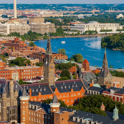 An aerial photo of the Georgetown University campus and the Potomac River.